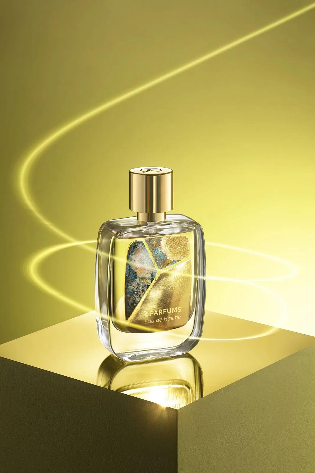 Eau de Hajime in the Patina bottle, three brass pieces on the glass