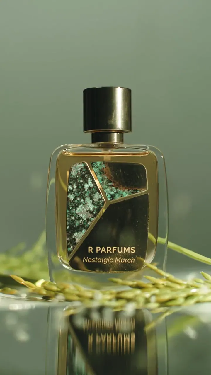 Film, 2022: Nostalgic March in the Patina bottle among rice, sugarcane and white blossom, with music, looping with the sound off.